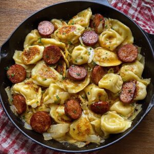 Pierogies and kielbasa skillet with caramelized onions golden fried pierogies and sliced smoked sausage