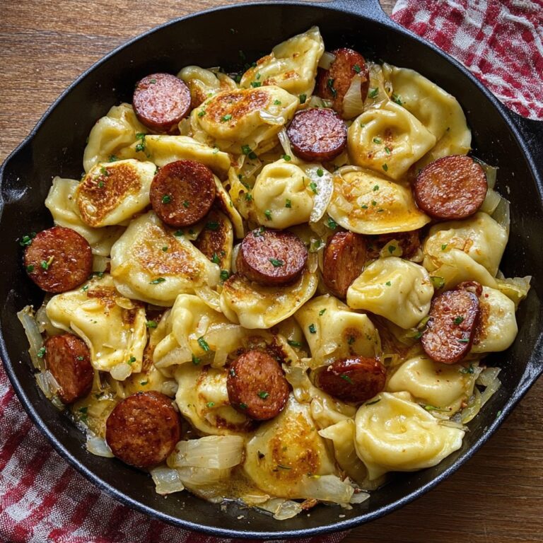 Pierogies and kielbasa skillet with caramelized onions golden fried pierogies and sliced smoked sausage